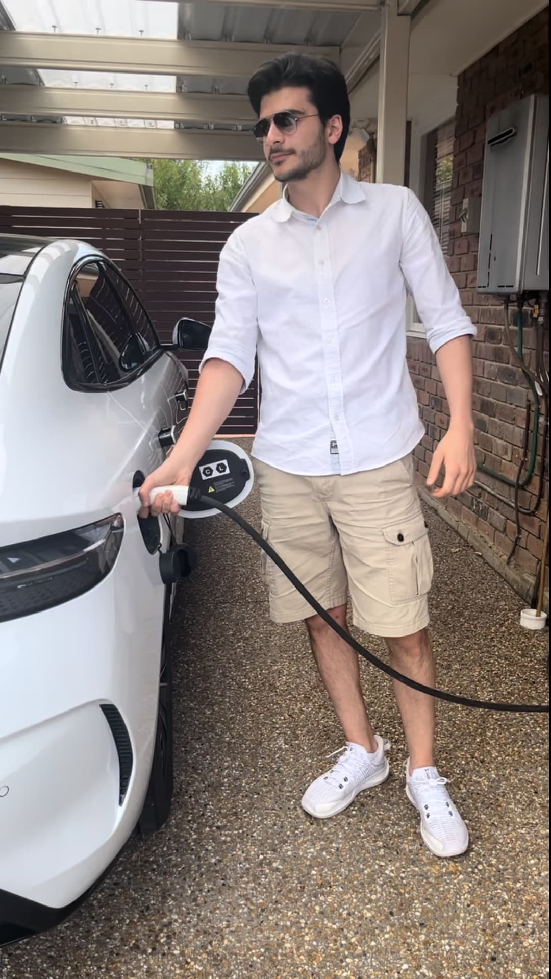 Driver charging an EV